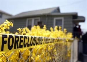 Police tape marked as a Foreclosure Free Zone is seen outside the foreclosed home of Marie Elie in Elmont