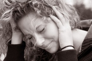 women-covering-ears-tinnitus-and-hearing-health