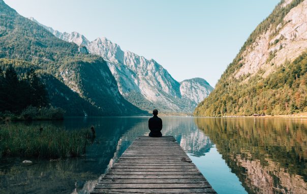 man-sitting-on-dock